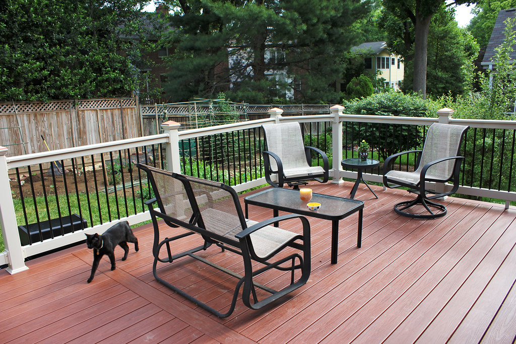 Finished backyard wood deck with seating area